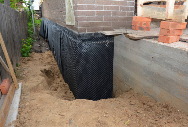 SJ Waterproofing Pros technician performing targeted Waterproofing assessment in Long Branch, VA